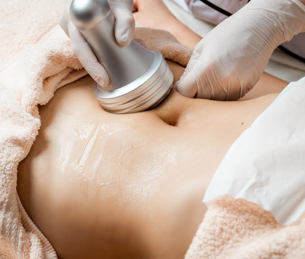 Hardware cosmetology. Body care. Spa treatment. Ultrasound cavitation body contouring treatment. Woman getting anti-cellulite and anti-fat therapy in beauty salon. Perfect shape buttocks